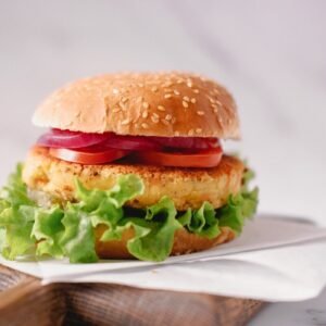 a chicken sandwich with lettuce and tomato slices