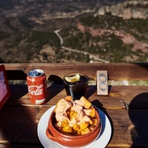 Coca-Cola soda can near food in bowl